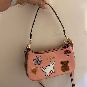 Blush, pink classic brown Coach handbag with embroidery